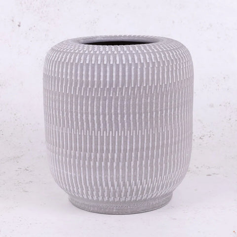 A cylindrical, grey ceramic planter with a textured surface.