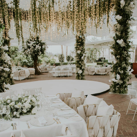 A wedding venue showing a floral, lit canopy.
