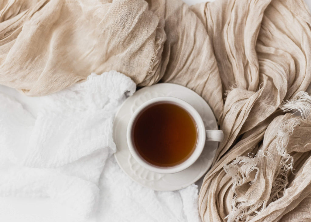 tea cup in a bed for self-care