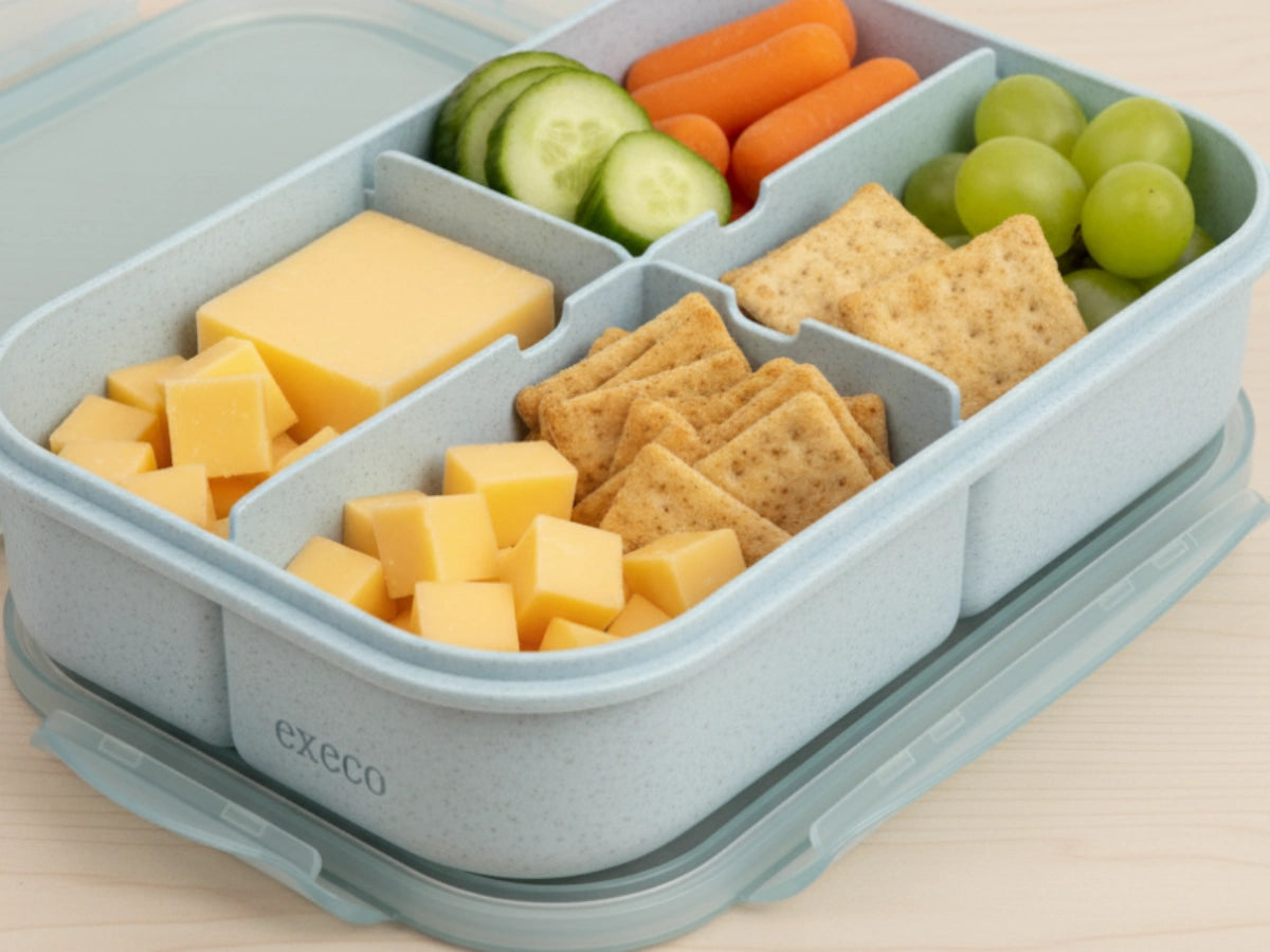 Cheese cubes and crackers with veggies in a blue Execo bento box