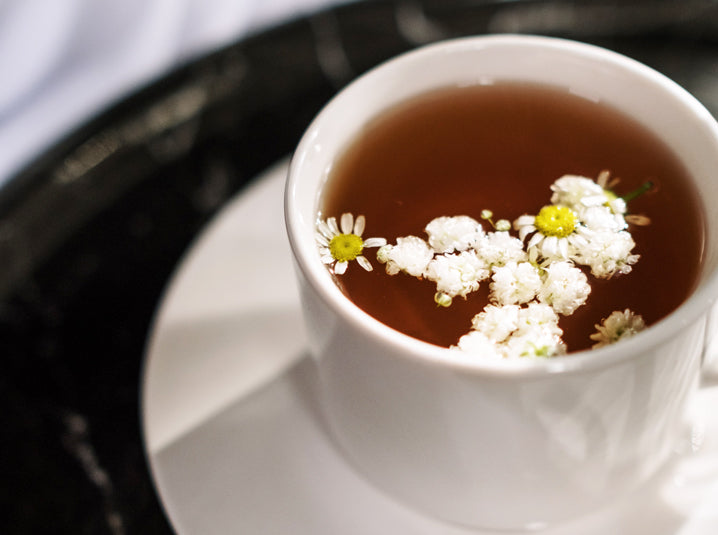 chamomile-tea-in-white-tea-cup-allergies-sore-throat-relief