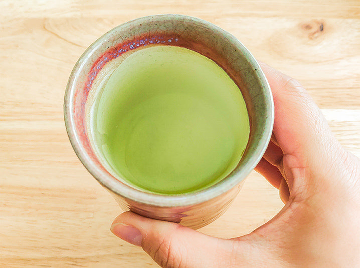 mindful ichigo ichie moment holding japanese green tea