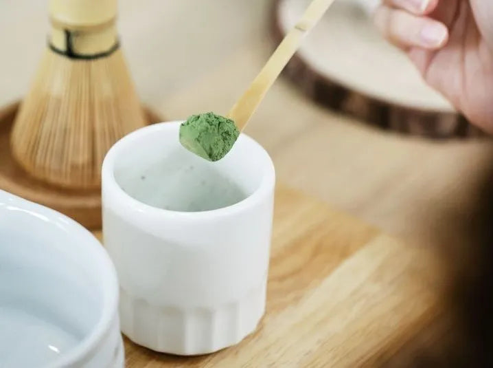 matcha powder on bamboo scoop to put in matcha bowl making matcha