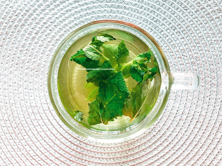 Peppermint Tea in a cup with mint leaves