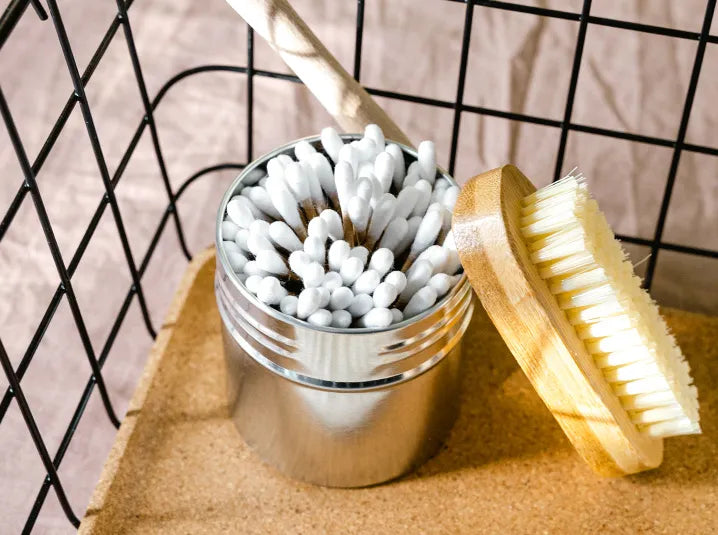 cotton sticks in a tea tin