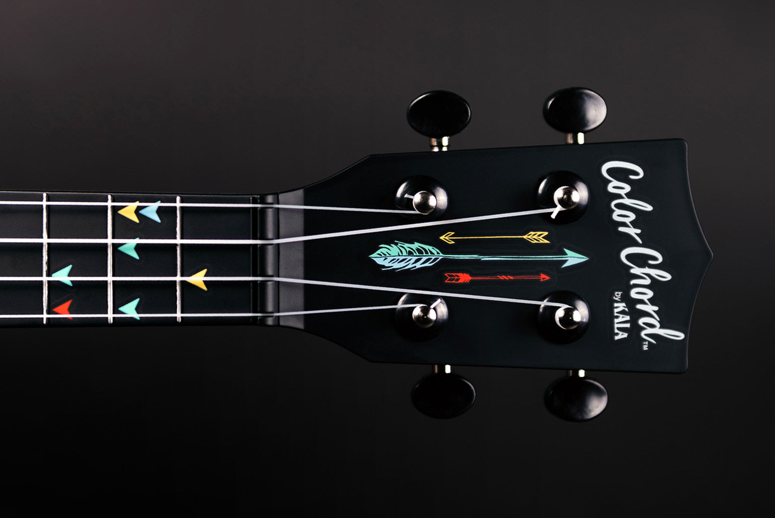 Kala Color Chord™ Ukulele Fretboard with Arrow Markers in four different colors: red, green, blue, an yellow. 