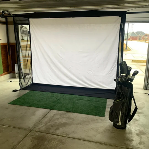 G-TRAK Retractable Impact Screen with garage door up.