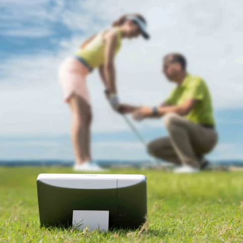 GolfJoy Golf Waver being used on the practice tee with instructor and student.