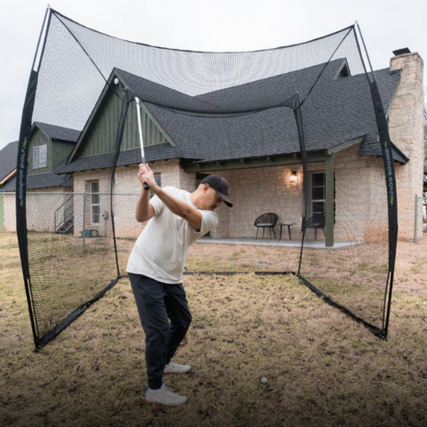 SIG 10' x 10' x 10' Square Golf Net outdoors with golfer.