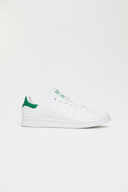 white adidas with green heel