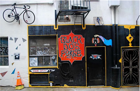 Exterior view of Black Dog Forge in Belltown, Seattle before 2017, showcasing the distinctive and artistic storefront that became a cultural landmark.