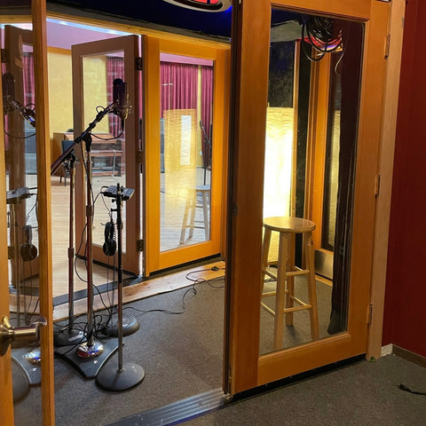 Vocal booth at London Bridge Studio with microphones, a space once used by Eddie Vedder and Chris Cornell.