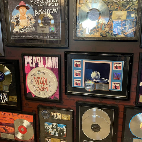 Collection of Pearl Jam's award-winning records and memorabilia displayed at London Bridge Studio.