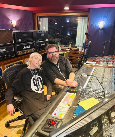 Taylor Momsen of The Pretty Reckless in the studio, sporting a 90TheOriginal t-shirt, embodying the brand’s fusion of grunge style and musical rebellion.