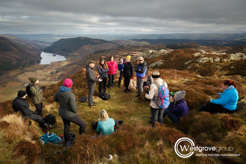 Westgrove group on mental wellbeing walk with Mind Over Mountains - seated group out in mountains