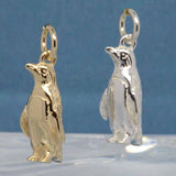 Gold and silver penguin charms