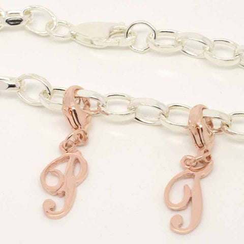 Rose gold italic letter charms on silver charm bracelet