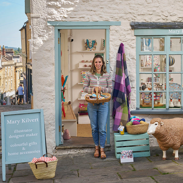 Mary Kilvert standing outside her shop at the top of Catherine Hill in Frome, Somerset
