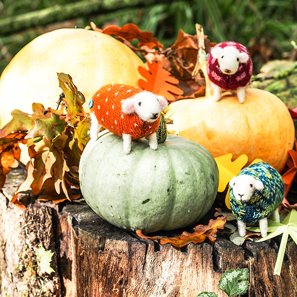 Mary Kilvert's felted sheep on squashes in an outdoor setting