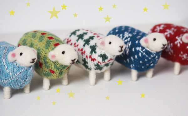 Felted sheep in jumpers in a row, hand madeby Mary Kilvert