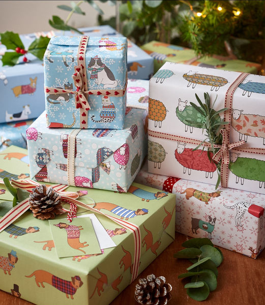 A stack of Christmas presents, beautifully wrapped in Mary Kilvert's wrapping paper