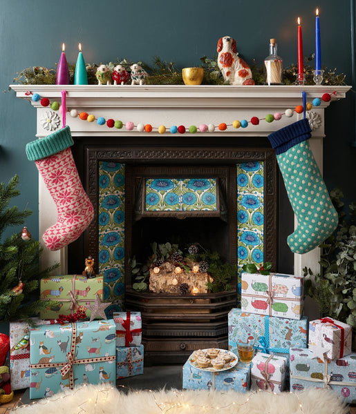 Mary Kilvert's fireplace, surrounded by Christmas presents and hanging stockings