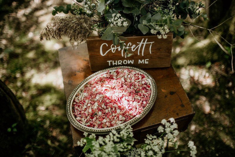 Petal Confetti in a tray with signage in a woodland
