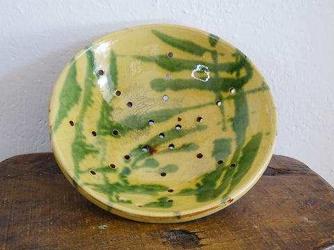 French antique glazed terracotta colander in yellow and green