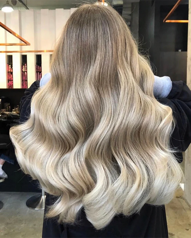soft brushed out curls with halo hair extensions