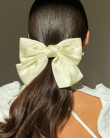 bow hairstyle on brunette hair