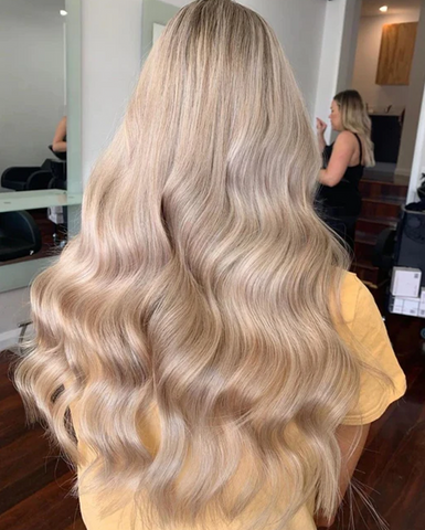 creamy blonde hair worn with a sitting pretty halo hair extension in shade col. 20c