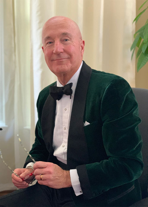 Andrew Poupart wearing Black Tie and velvet smoking jacket