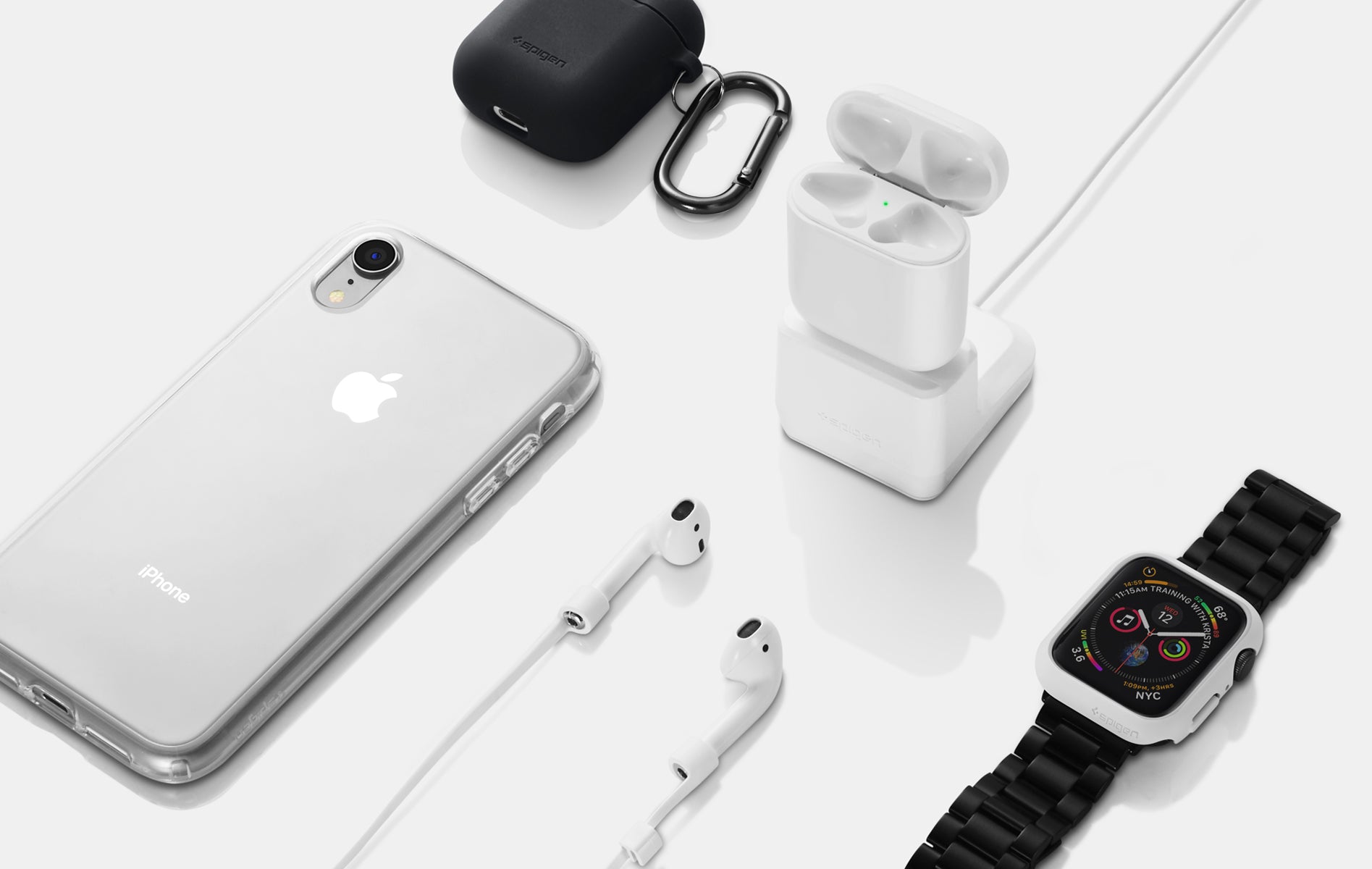 A collection of Airpods Silicone Black case, Airpods charger, iPhone in clear case, Airpods with a strap, and an Apple watch with black band.