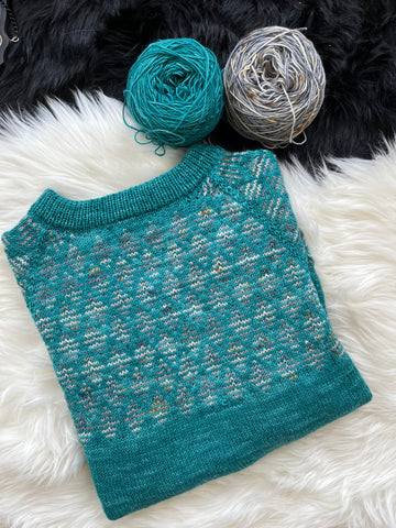 Sample of the Ali's Sweater Light with two cakes of yarn.