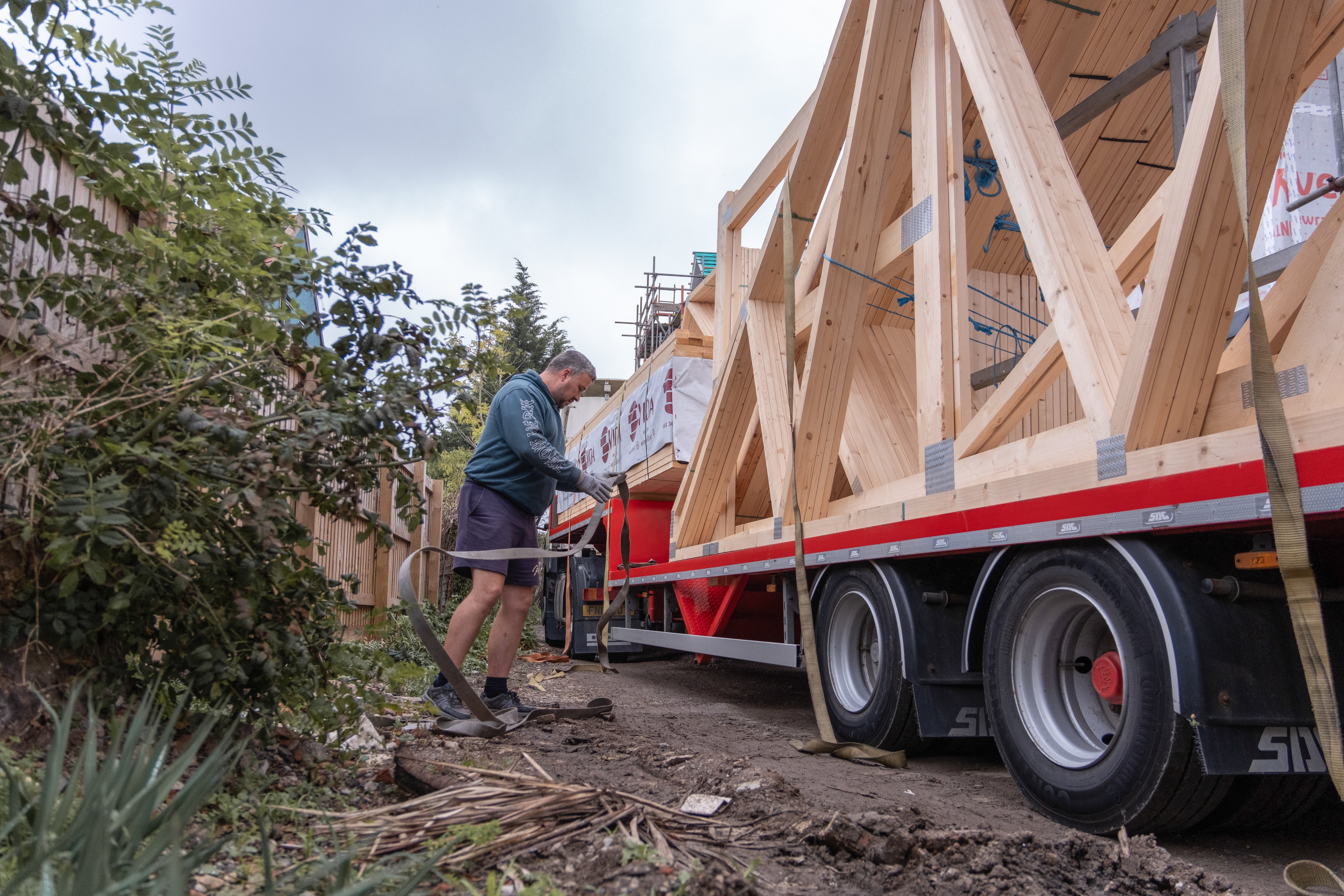 trusses being unloaded from a lorry