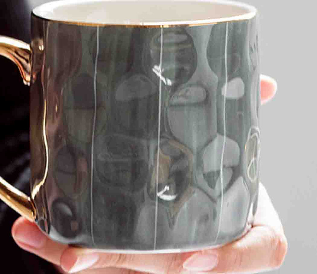 Hammered Texture: The unique hammered texture of this mug adds depth and sophistication, creating an intriguing visual appeal that stands out on any table.