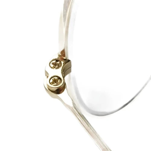 A close-up image of a pair of Ray-Ban replacement screws attached to a metal frame, presumably part of a pair of sunglasses.