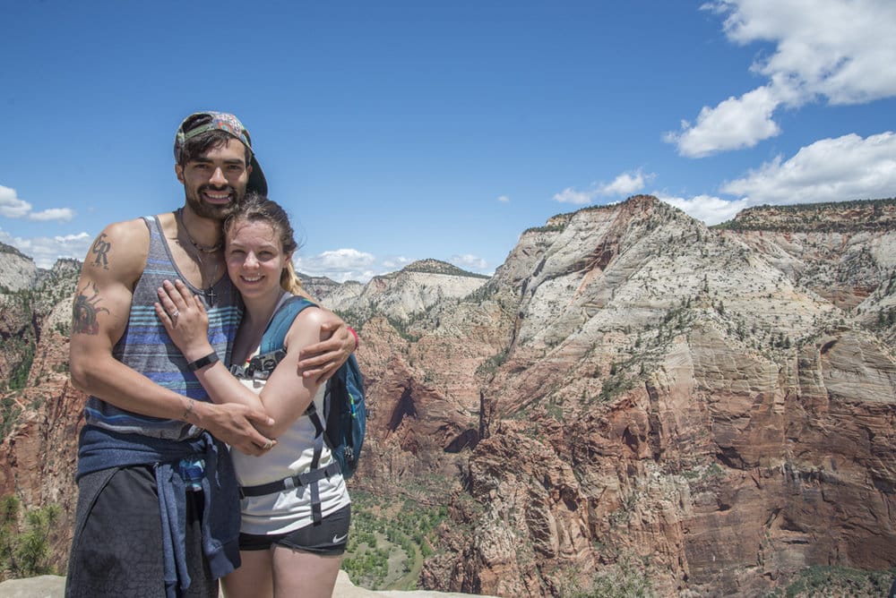 Alexis and Margaret, newly engaged, atop Angels Landing in Zion National Park, with the Celtic Spiderman engagement ring custom made for them by Takayas