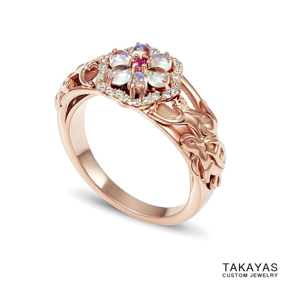 Custom rose gold cat and turtle engagement ring with a flower centerpiece of moonstones, diamonds, and a pink sapphire, by Takayas Custom Jewelry