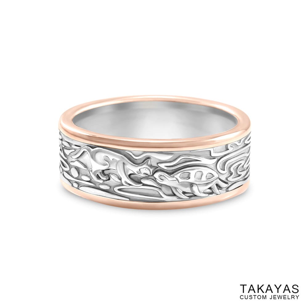 Photograph of custom men's wedding band with a cat and turtle kissing and organic patterns, by Takayas Custom Jewelry - front view