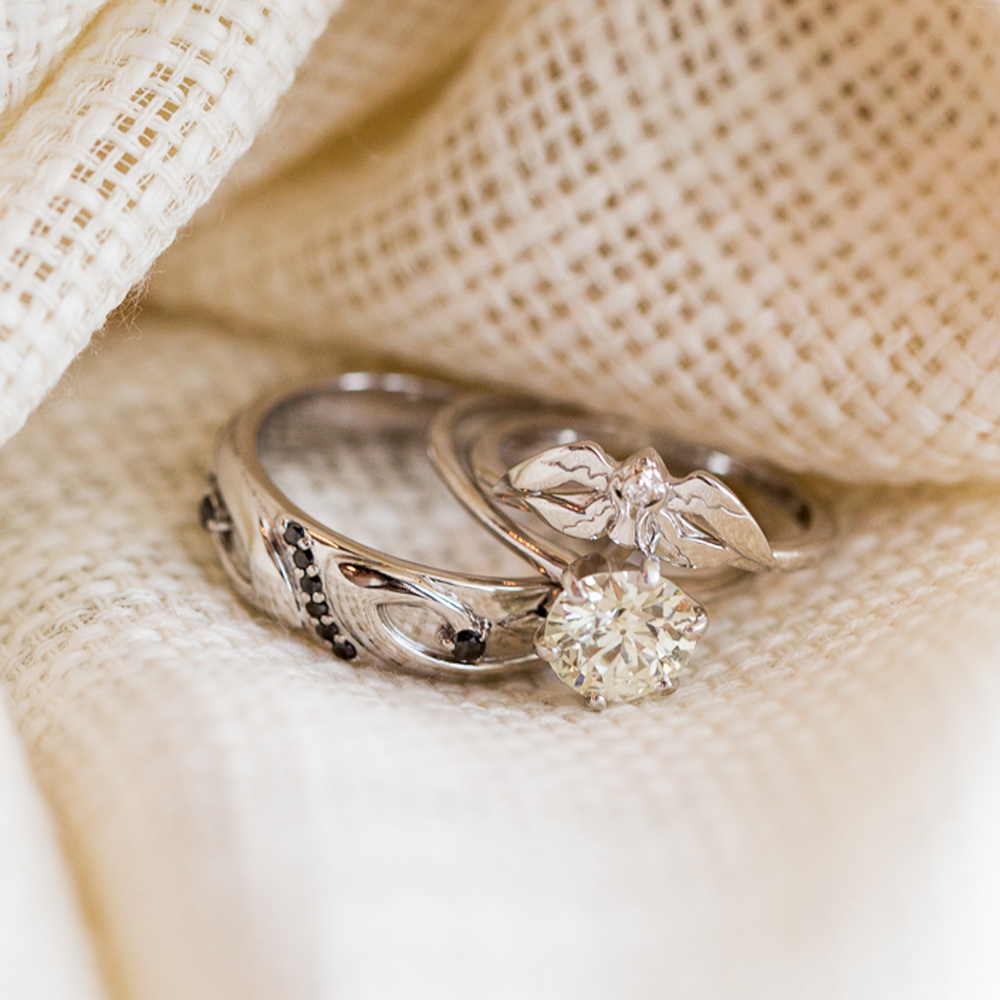 Photograph of Ben & Cassie's White & Black Mage rings by Takayas, on their