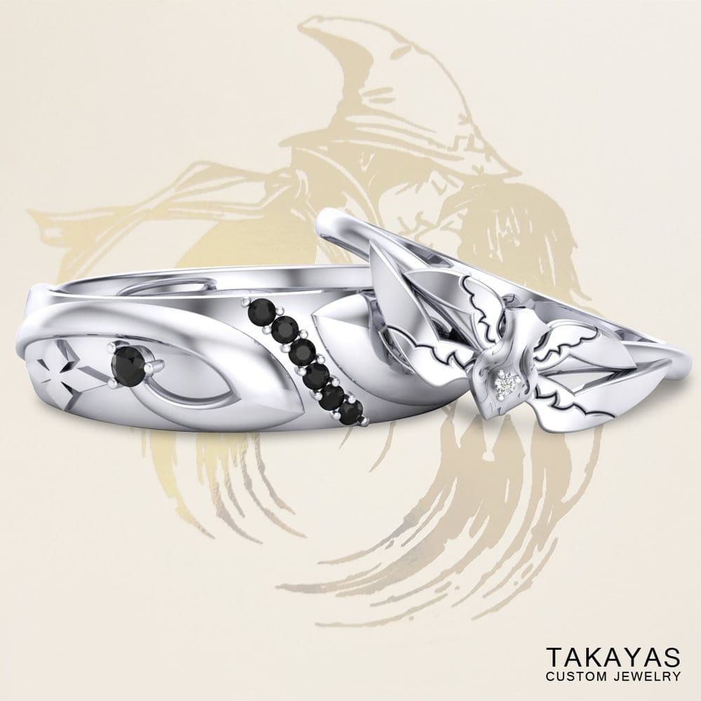 Final Fantasy Black & White Mage inspired wedding rings by Takayas, with Ben and Cassie's custom wedding invitation logo in the background