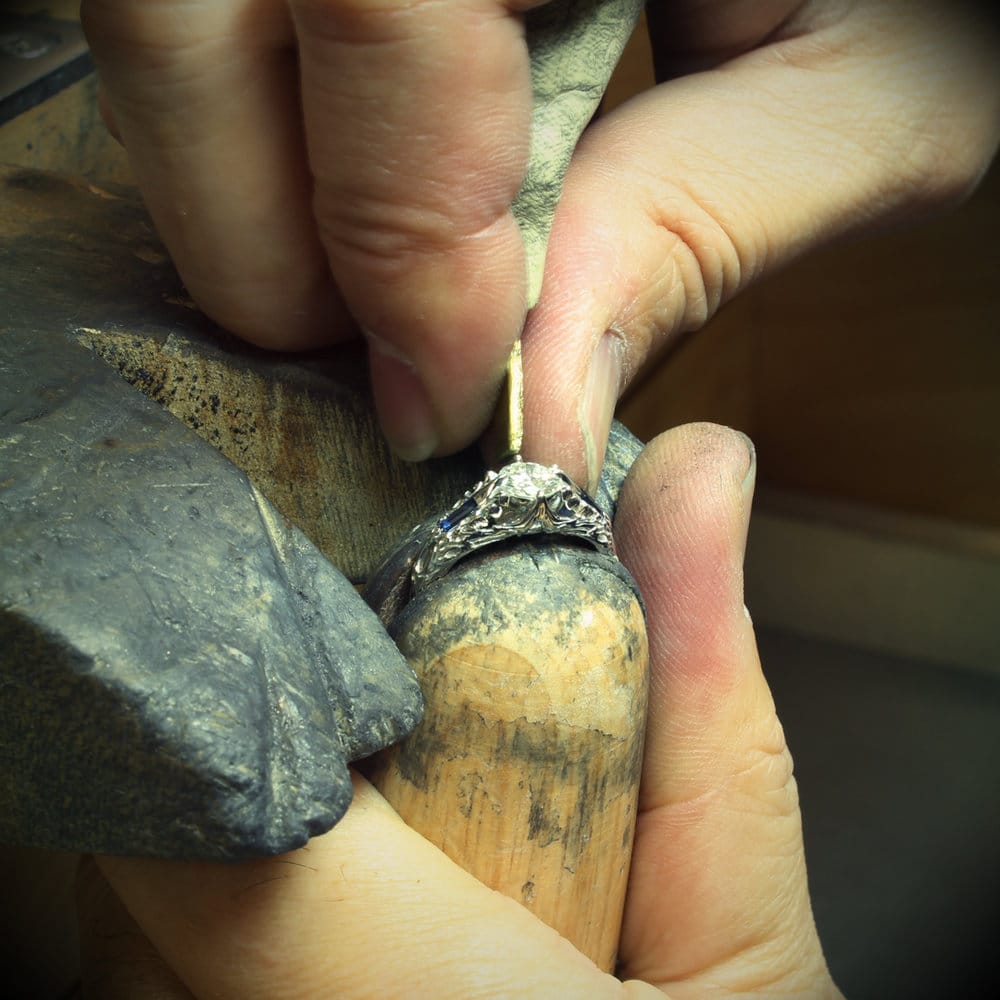 Takayas setting the center stone in the custom FFXIV Scholar inspired ring