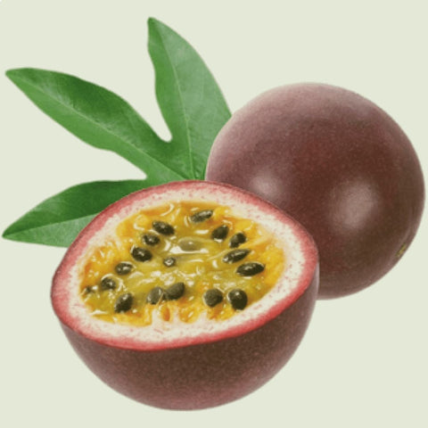 Close-up image of a passionfruit cut in half, revealing its vibrant, juicy pulp and numerous black seeds inside. The texture and rich color of the fruit are prominently displayed against a neutral background.