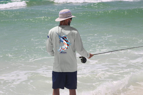 Angler wearing performance gear from the MSC Americana collection as he fishes along the waters edge.