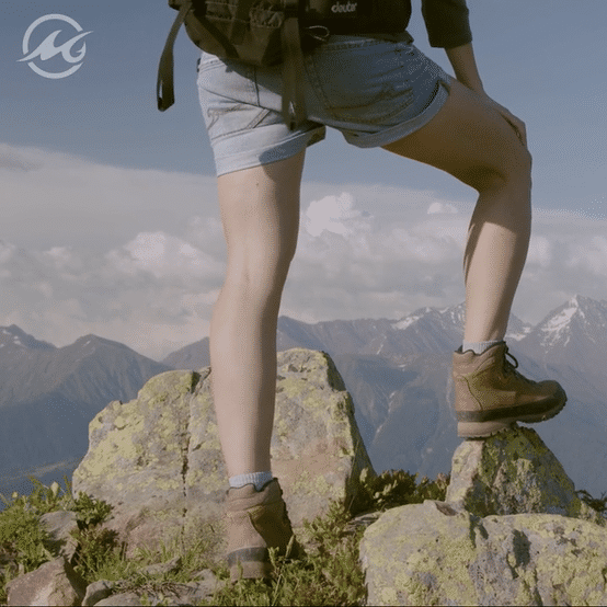 Animated gif of hiker's legs on a mountain top and the word Conquer. A MSC pro staffer in hiking gear.