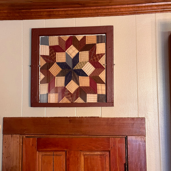 Quilt in an old window frame