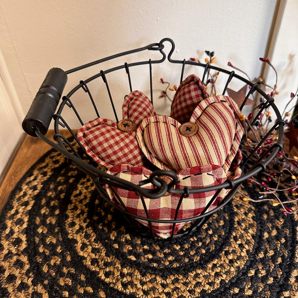 black wire basket with heart ornaments