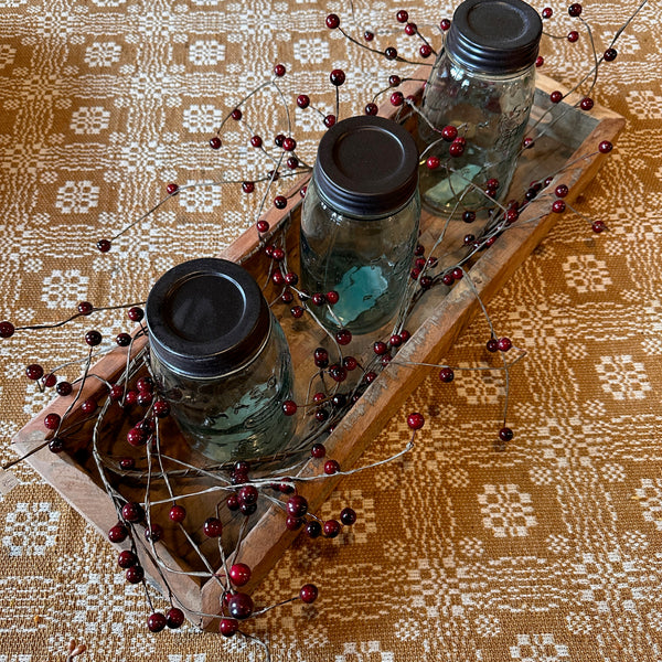 mason jars in wood centerpiece