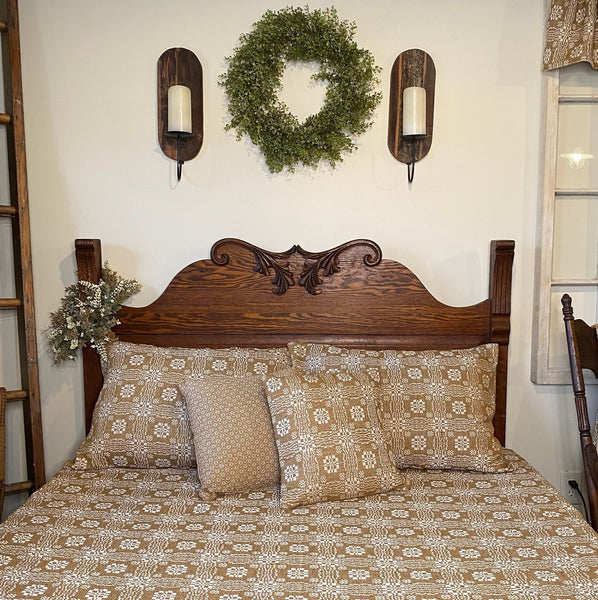 Wreath above the bed